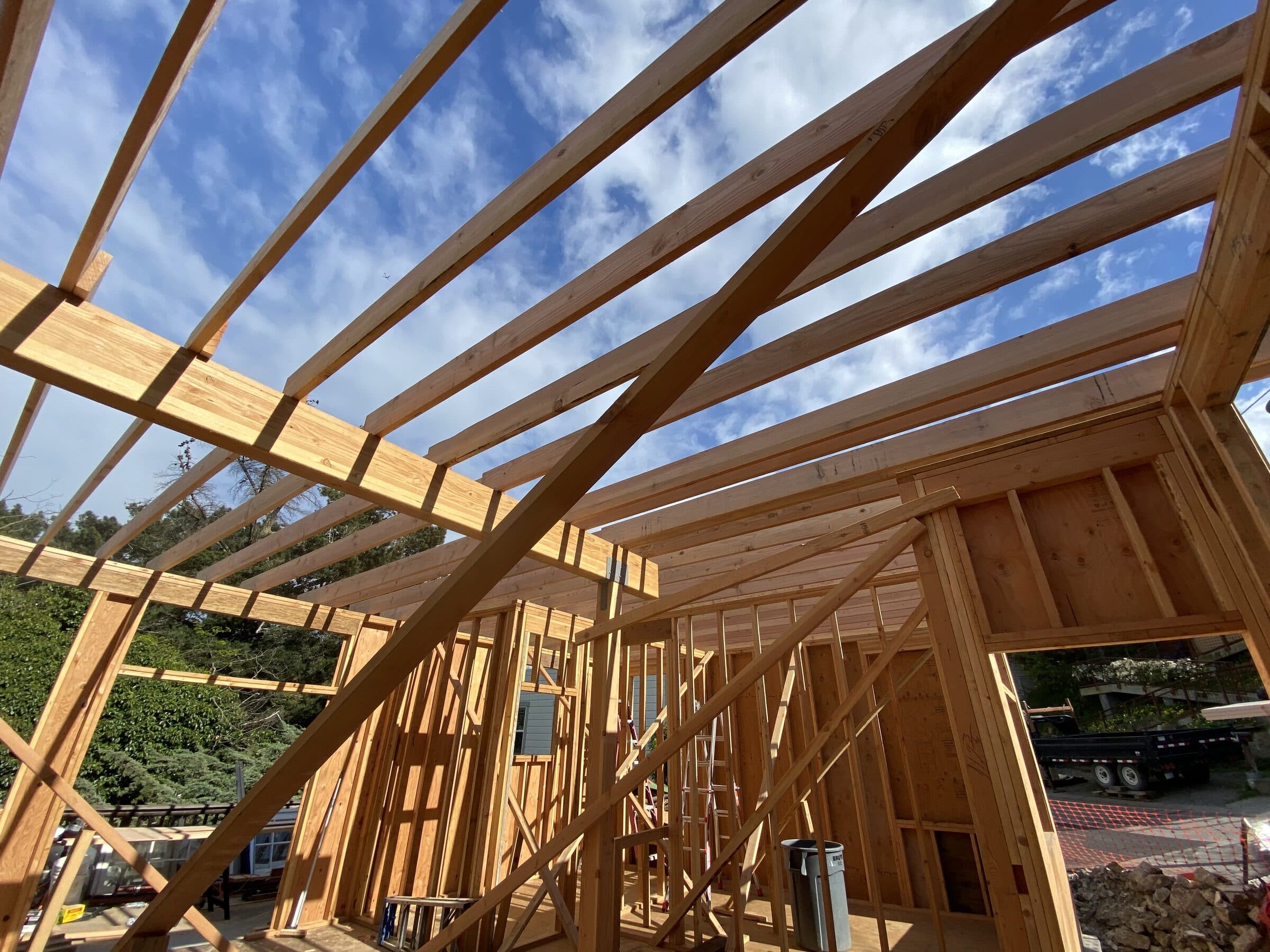 The single-slope skillion roof framing against blue sky